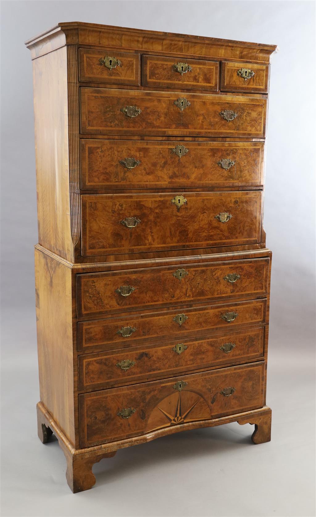 A George II figured walnut secretaire chest on chest, W.3ft 5.5in. D.1ft 10in. H.6ft 4in.